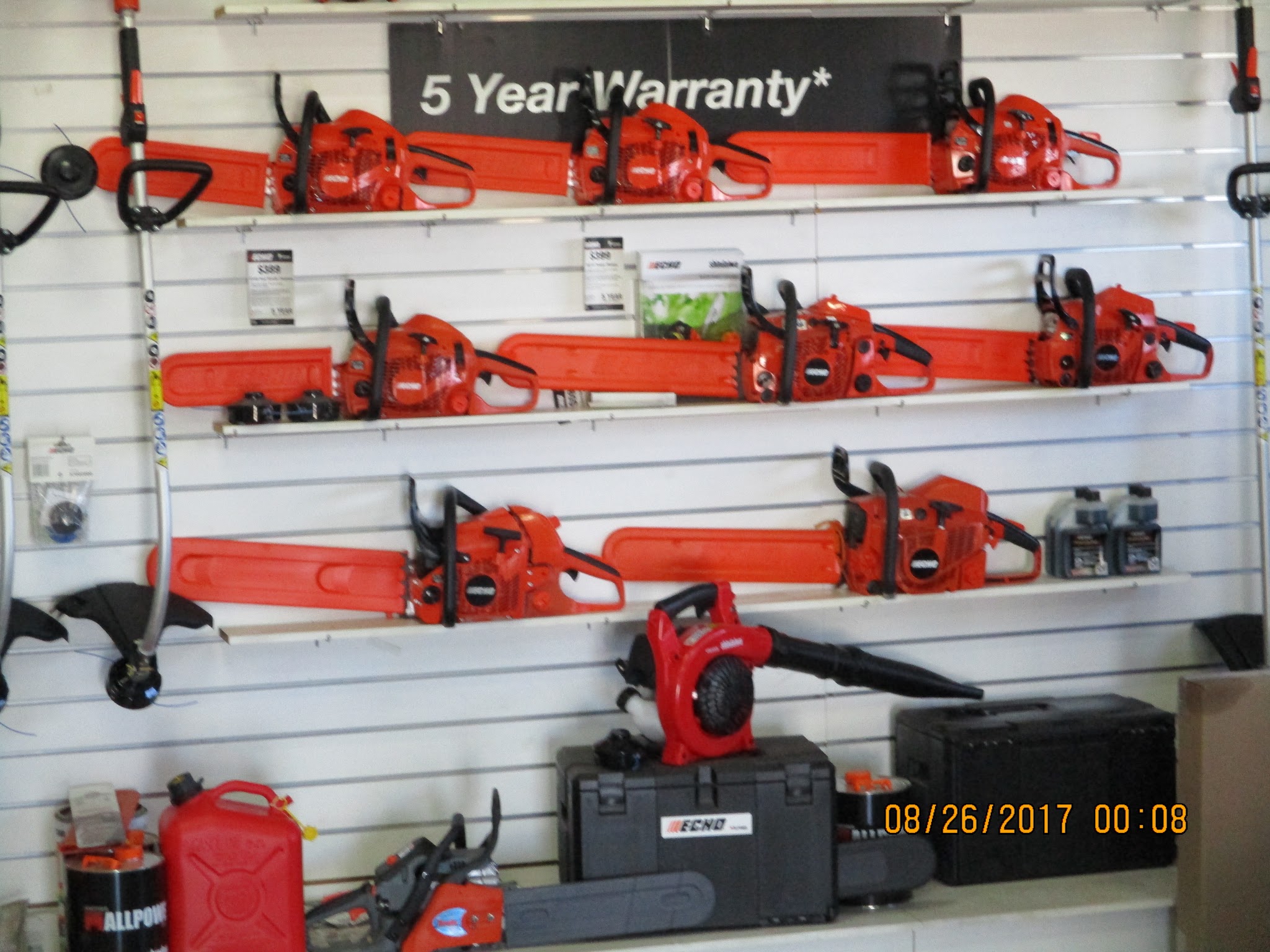 Racks of Echo chainsaws on the wall of the COPES showroom in Cowra